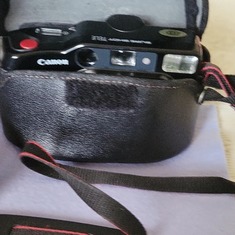 Canon Vintage Black Film Camera with Red Accents
